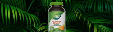 Nature's Way Vitamin C gummy on leafy green background