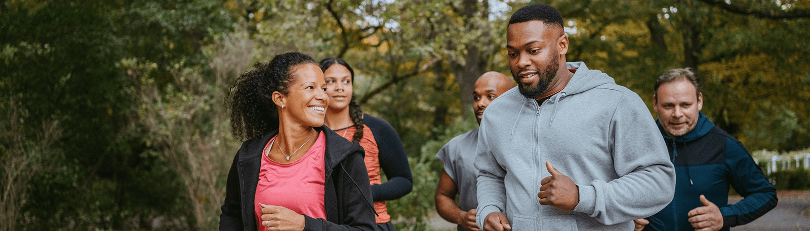 Group of people on a run in the forest