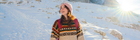 Woman in the snow on a hike.