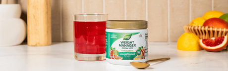 Weight Manager drink mix in a glass on kitchen counter