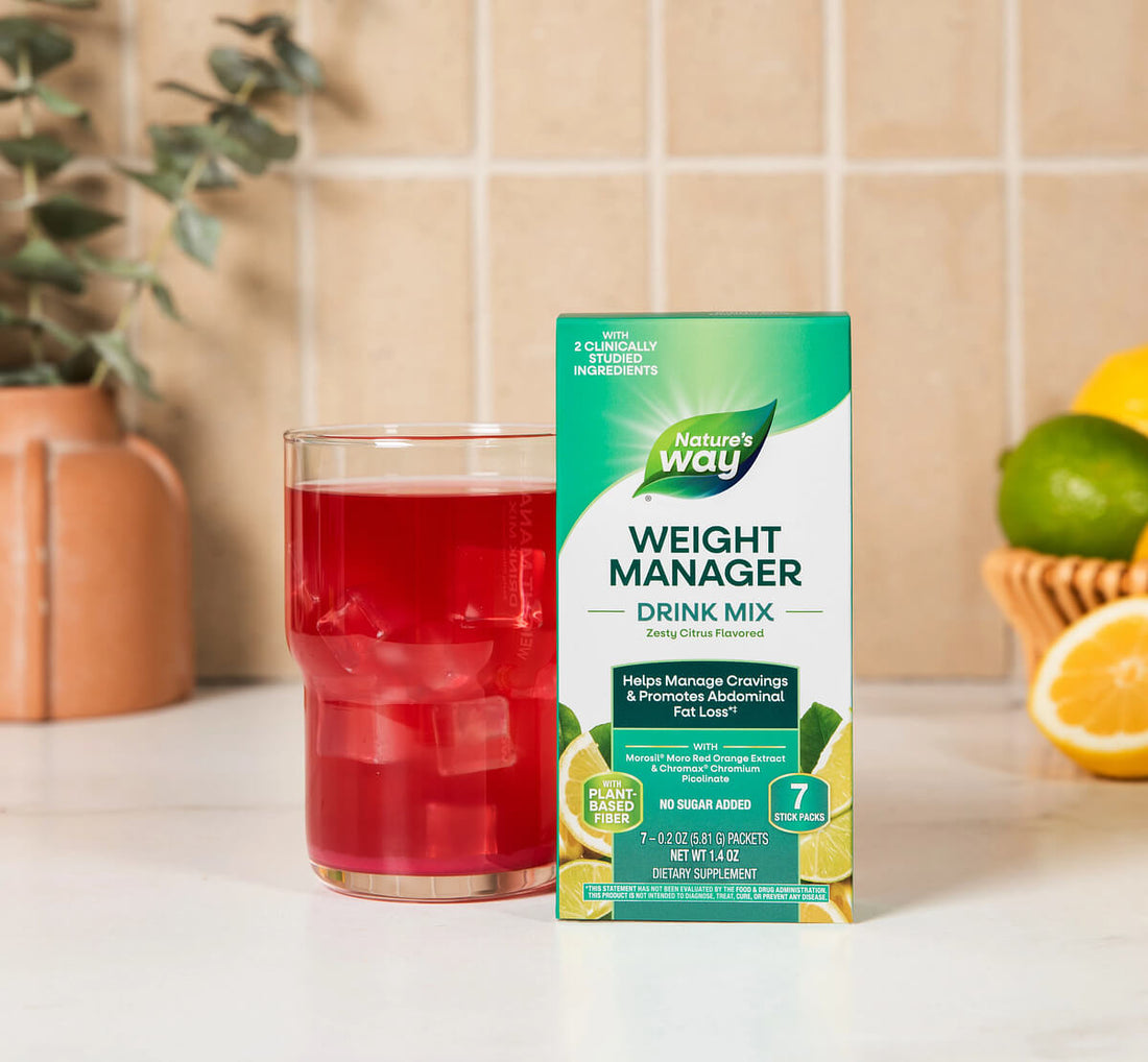 Nature's Way Weight Manager Drink Mix box with a glass of red drink on a kitchen counter.