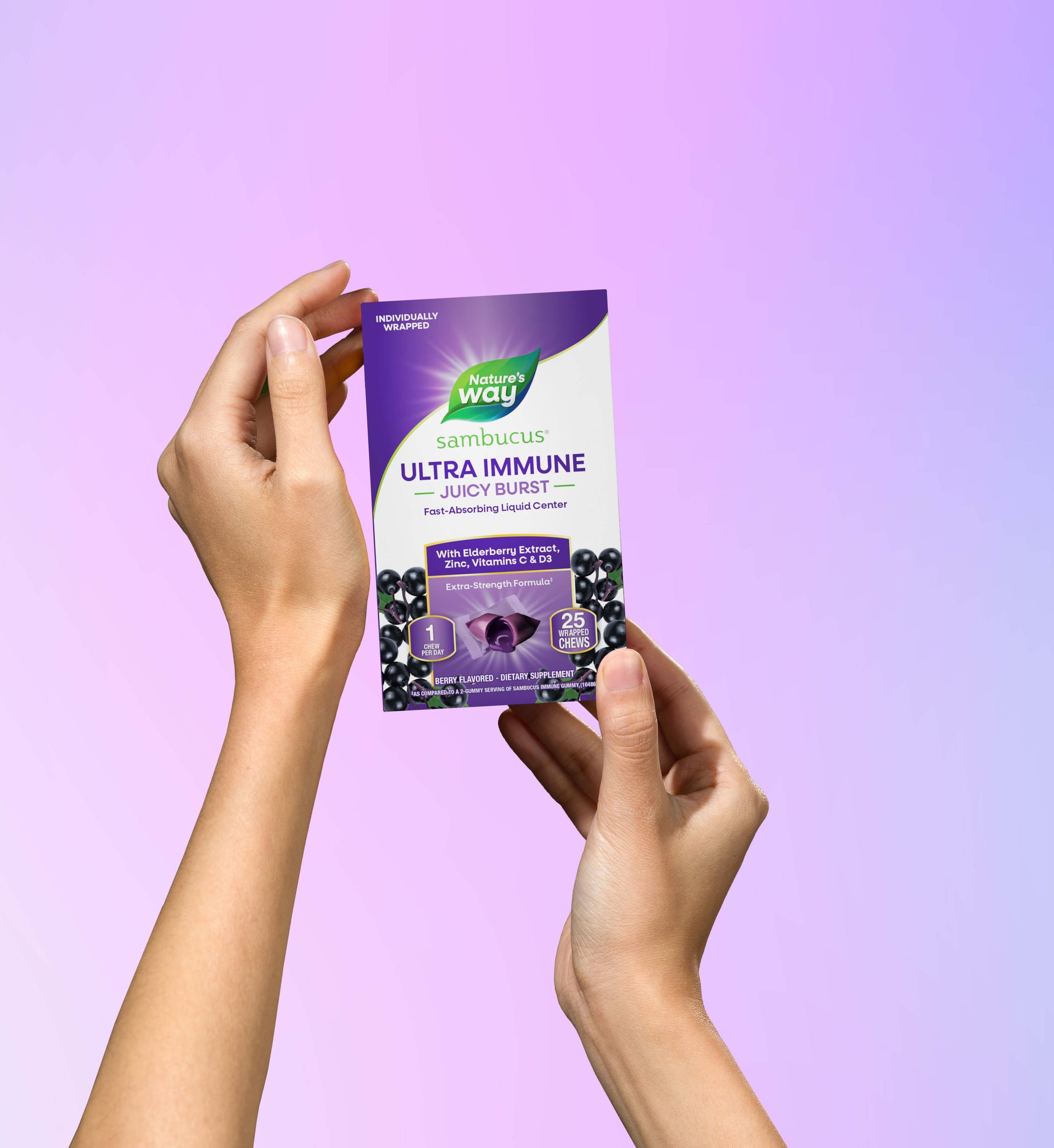 Hands holding Sambucus Ultra Immune Juicy Burst pack 