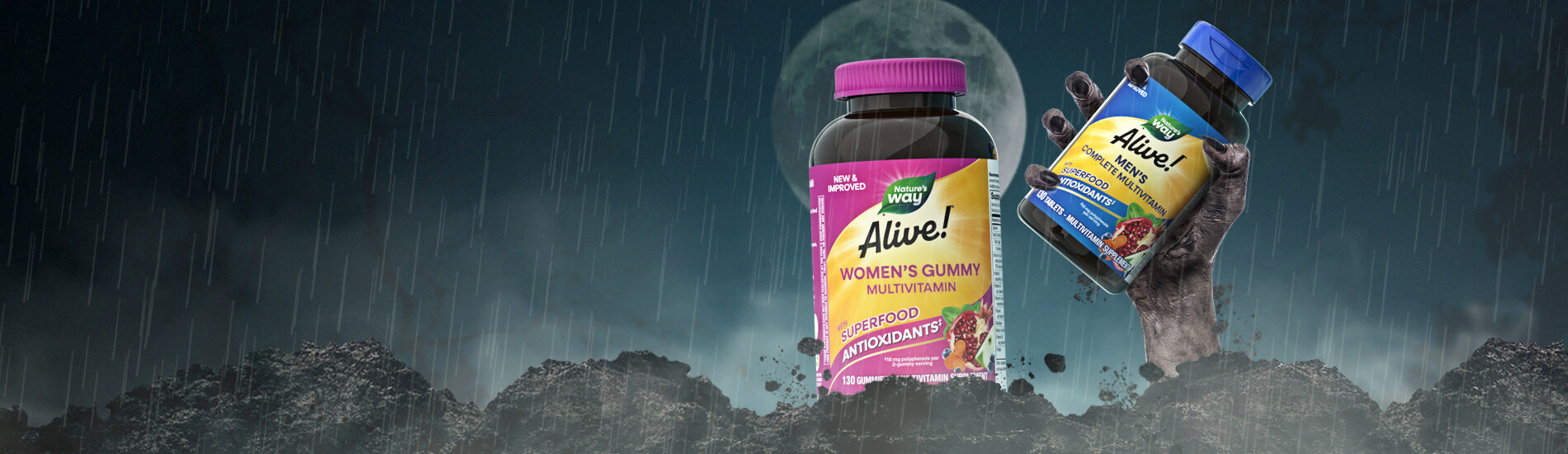 Two bottles of Nature's Way Alive! products on a dark background in dirt with a zombie hand coming out of the ground.