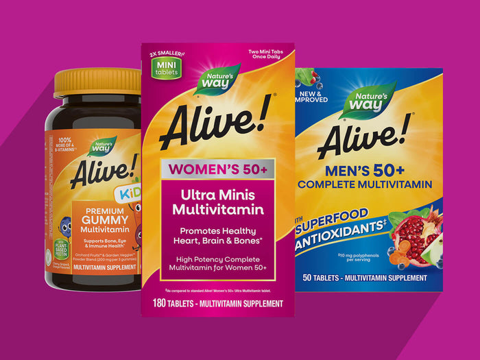 Three Nature's Way Alive! multivitamin supplement products displayed together on a bright pink background: a Kids bottle with a yellow cap, a Women's 50+ box, and a Men's 50+ box.