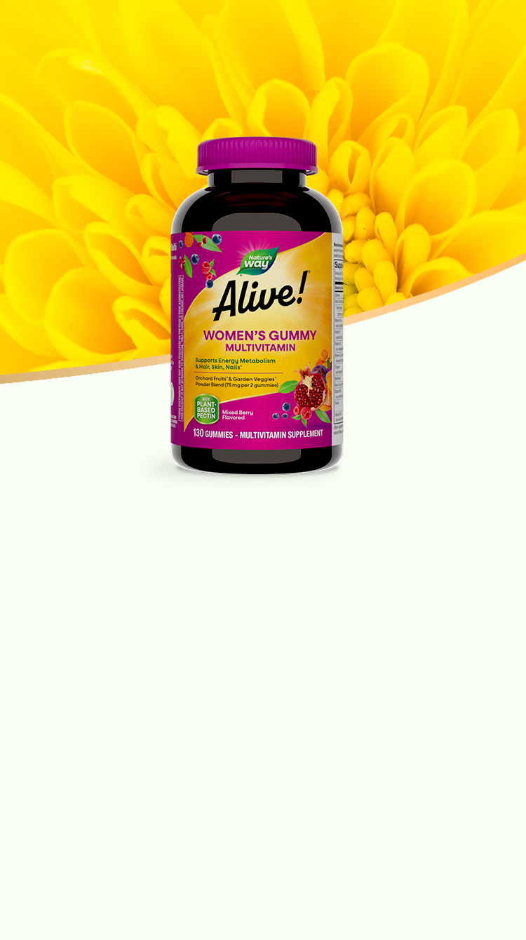 Bottle of Alive Women's gummy multivitamin on a bright yellow flower background