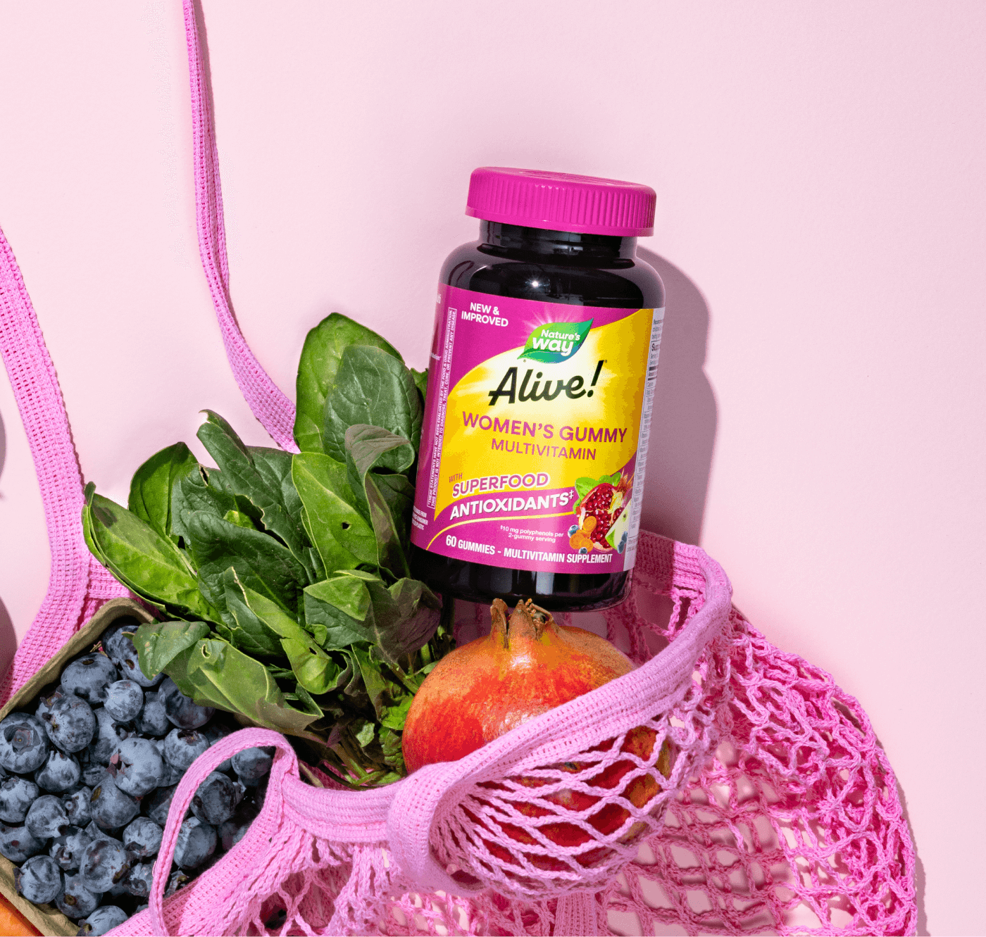 Bottle of Alive! Women's Gummy Multivitamin in a pink grocery bag