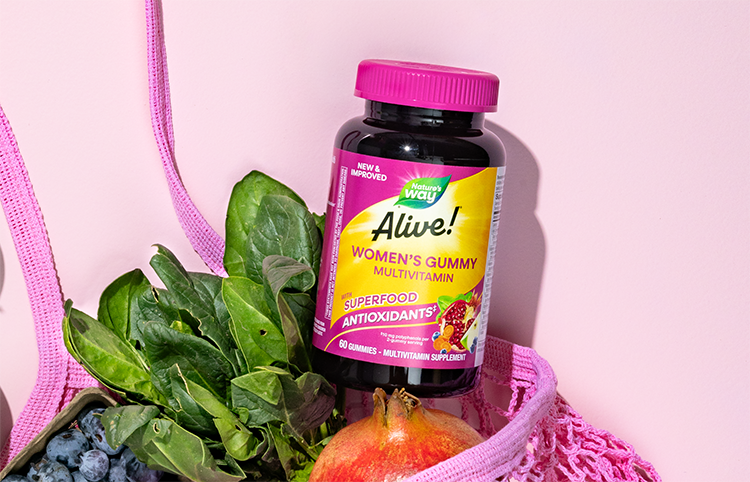 Bottle of Alive! Women's Gummy Multivitamin in a pink grocery bag