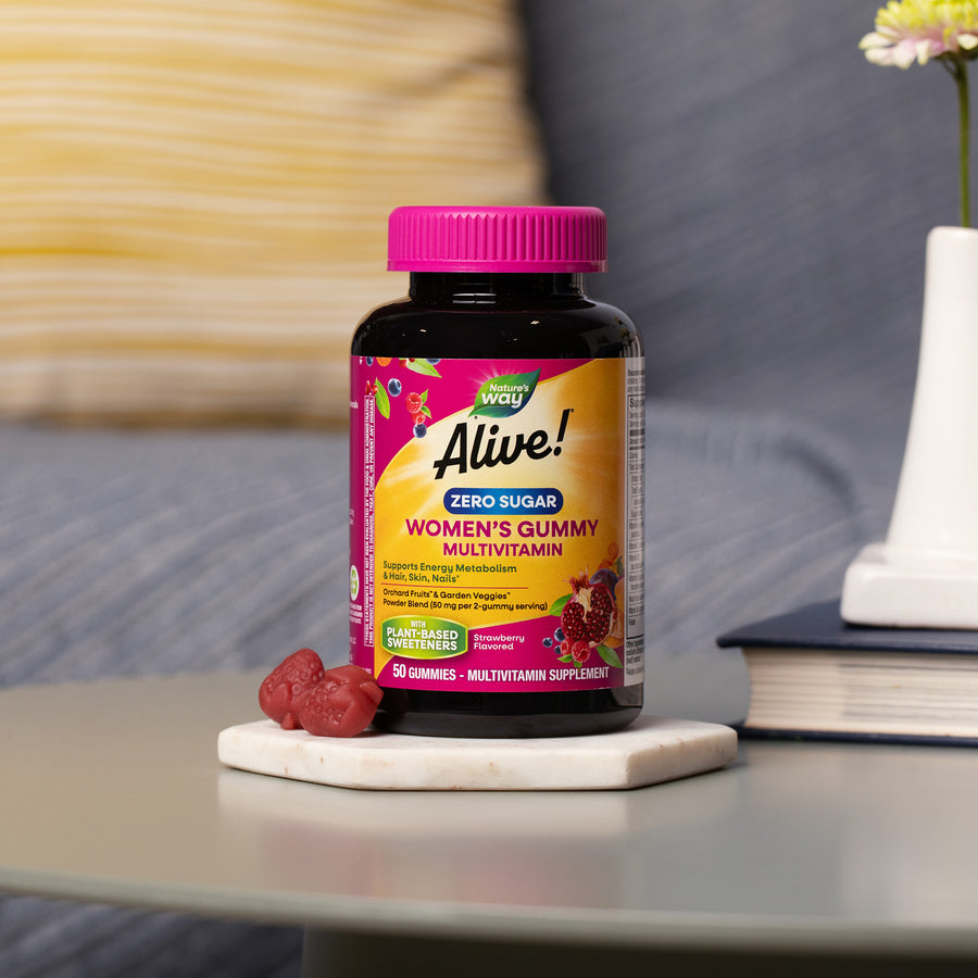 Bottle of Alive! Zero Sugar Women's Gummy Multivitamin sitting on a coffee table