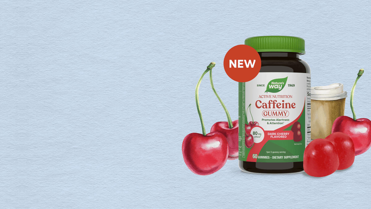 A bottle of  Caffeine Gummy vitamins with a green cap and a red 'NEW' sticker, styled with fresh red cherries on a light blue textured background.