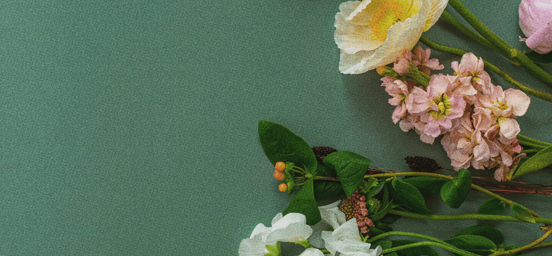 Floral arrangement on a green background