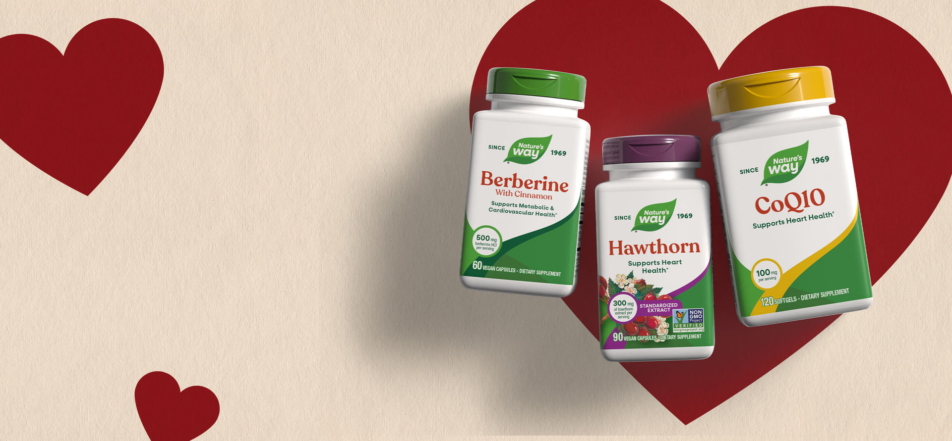 Three supplement bottles on a beige background with red hearts