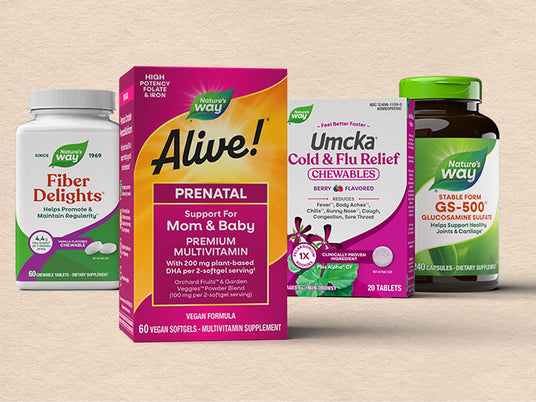Collection of health supplements including Fiber Delights, Alive prenatal vitamins, Umcka cold and flu relief, and Nature Way GS-500 on a beige background.