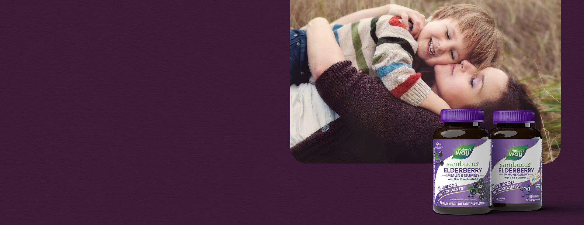 Woman holding a child with two bottles of Nature's Way Elderberry Syrup on a purple background