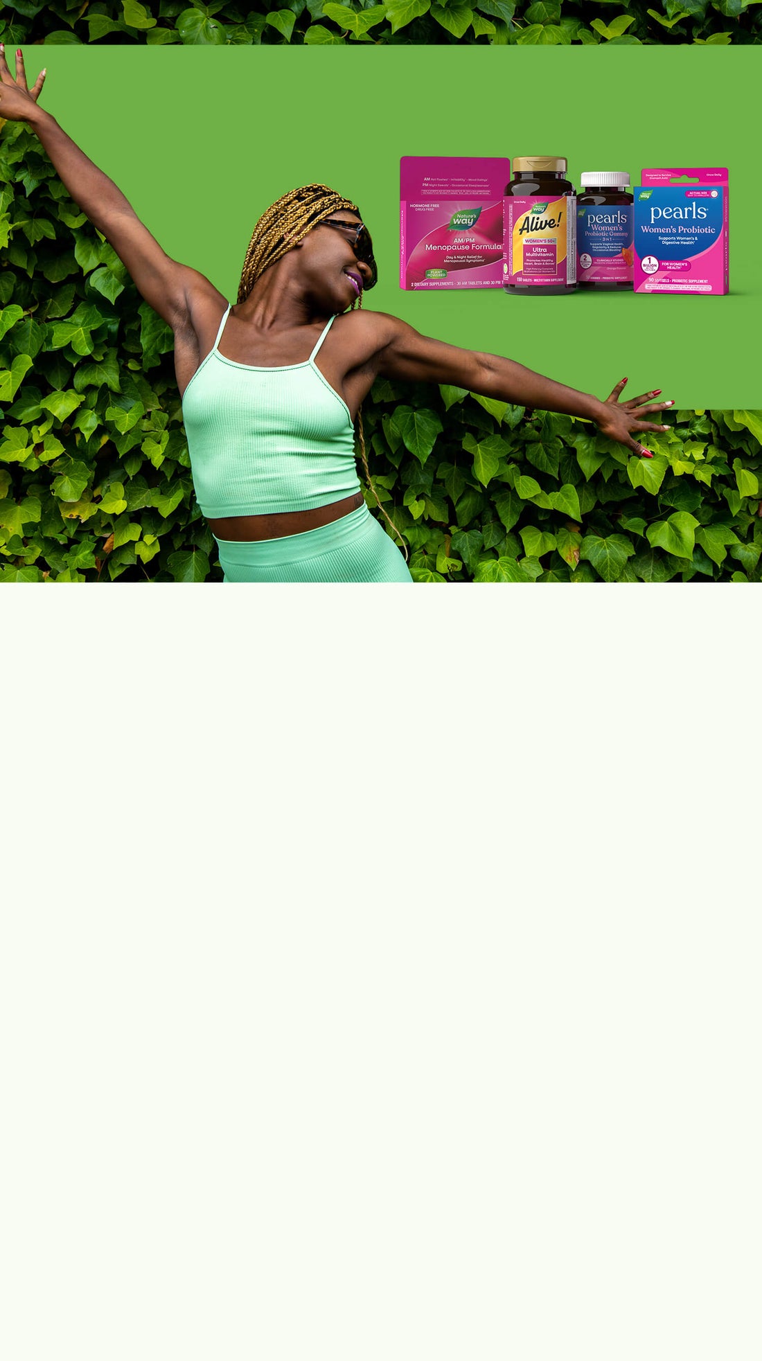 Woman in a green outfit standing against a green leafy background with product packaging displayed.