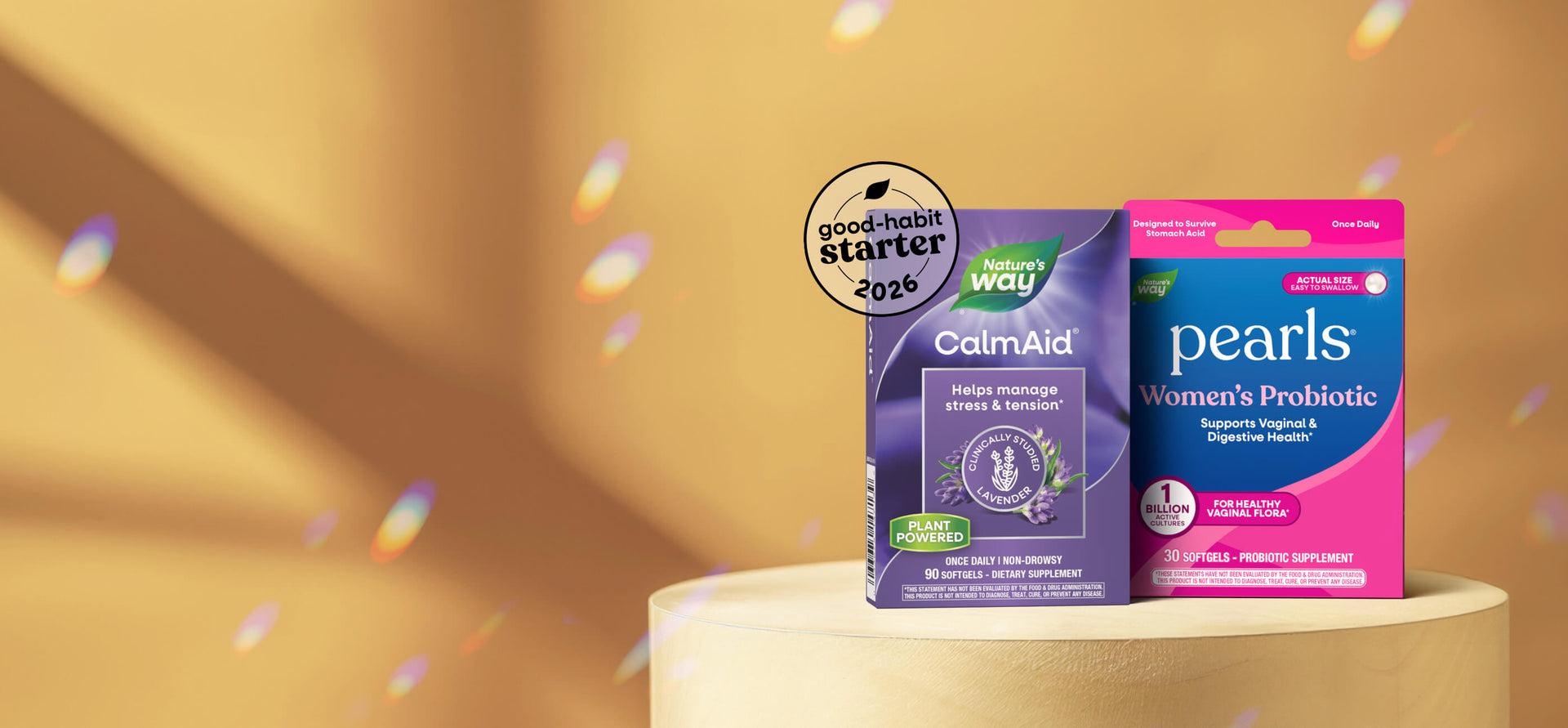 Two probiotic product boxes on a wooden surface with a warm background