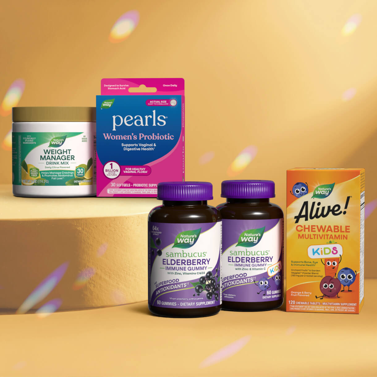 Assorted health and wellness products including a weight manager supplement, probiotic package, elderberry gummies, and a multivitamin for kids on a yellow background.