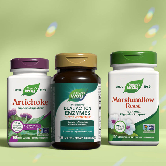 Three Nature's Way digestive health supplement bottles on a green background