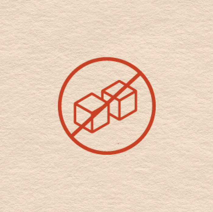 Red prohibition symbol over two cubes on a beige textured background