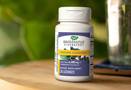 A bottle of Nature's Way Sambucus Immune Lozenges 30 count on a wooden surface