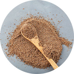 <{%ATTRIBUTE1_15405%}>Milk thistle seed with a wooden spoon.